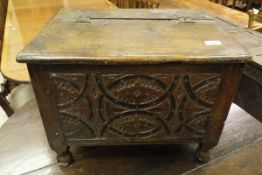 A 19th Century carved oak small coffer / coal box with carved front panel and hinged lid (possibly