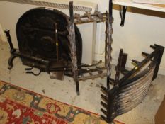 A cast iron fire back bearing date 1571, together with fire basket,