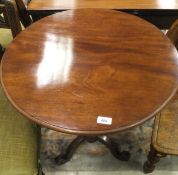 A Victorian mahogany pedestal occasional table on tripod base and a Victorian mahogany panel seated