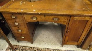 An early 20th Century oak double pedestal desk (ex Pinehurst School Swindon),