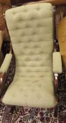 A 20th Century button upholstered rocking arm chair in the Victorian style