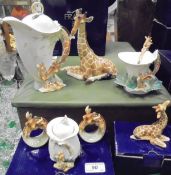 A collection of Franz Porcelain "Giraffe" pattern china wares to include giraffe mother figurine,