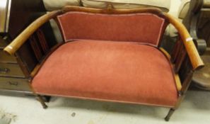 An Edwardian mahogany and inliad framed salon settee on turned and reeded front supports