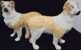 Two Staffordshire figures of dogs standing upon all fours