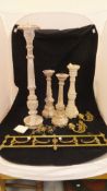 A pair of painted wooden pricket candlesticks and two others, a copper coal helmet,