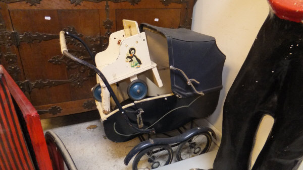 A vintage dolls' pram and painted child's three wheel chair