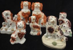 A collection of seven assorted Staffordshire spaniel figures