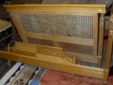 Two beech single bed frames with caned headboards