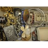 A box of assorted costume jewellery to include various brooches, bangles,