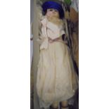 A Victorian wax-headed doll with wax and cloth body with original clothing,