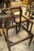 A pair of early 20th Century mahogany bar back elbow chairs,