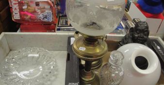 Two brass oil lamps and shades, a baluster shaped hobnail and facet cut decanter and stopper,