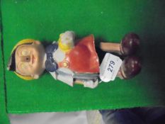 A composition bodied clockwork Pinnochio figure CONDITION REPORTS Nothing is sold as