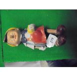 A composition bodied clockwork Pinnochio figure CONDITION REPORTS Nothing is sold as