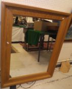 A modern oak framed rectangular wall mirror