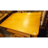A modern oak table, the plain top above turned and ringed legs,