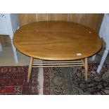 A light elm Ercol beech oval coffee table with slatted under tier CONDITION REPORTS