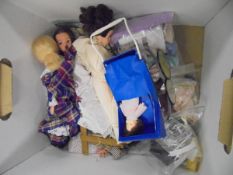 A box containing a Pelham puppet "Andy Pandy", three various Sindy dolls, various clothing,