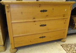 A 19th Century Continental pine coffer with rising lid above three dummy drawers flanked by a