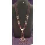 A silver and garnet multi-strand beaded necklace