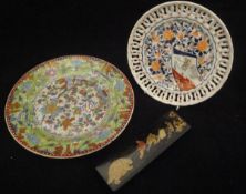 A Chinese polychrome decorated green ground plate,