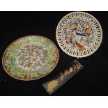 A Chinese polychrome decorated green ground plate,