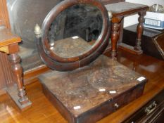 An early 19th Century oval mahogany dressing table mirror with single drawer to base