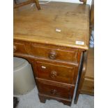 A pine topped dressing table with seven assorted drawers to bracket feet