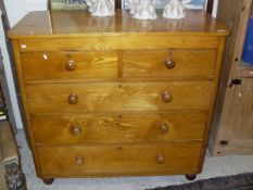 A Victorian ash chest of two short and three long graduated drawers to turned feet