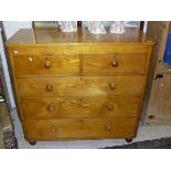 A Victorian ash chest of two short and three long graduated drawers to turned feet