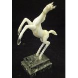 A 20th Century Istvan Komaromy lamp work figure of a rearing horse in opalescent white glass raised