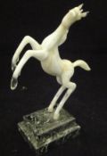 A 20th Century Istvan Komaromy lamp work figure of a rearing horse in opalescent white glass raised