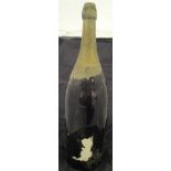 A bottle of 1970's un-named Champagne, 3l, bearing remnants of old label and date "197?",