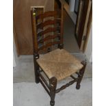 A set of ten oak ladder back rush seated dining chairs CONDITION REPORTS One chair