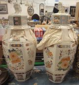 A pair of Chinese style octagonal lidded vases bearing name within print "V.V.