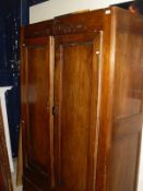 A French walnut two door armoire with single drawer under