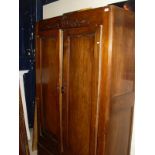 A French walnut two door armoire with single drawer under