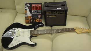 A Yamaha Pacifica Stratocaster style guitar and soft case,