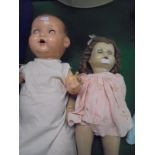 An Armand Marseille composition doll with five piece bent limb body,