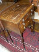 A Regency mahogany drop leaf work table,