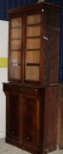 A pair of mahogany two tier bookcases, the two glazed doors, enclosing false bookshelf behind,