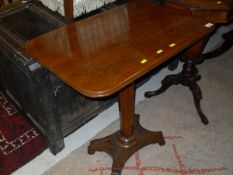 A 19th Century mahogany occasional table on a single faceted column to platform base terminating in