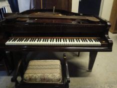 A mahogany cased baby grand piano,