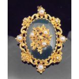 A 9 carat gold mounted pendant / brooch set with central oval jade panel,