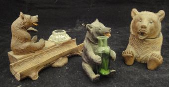 Three various carved wooden Black Forest type bear inkwells of differing designs