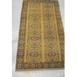 An Afghan rug, the ten central elephant foot medallions in pale gold,