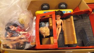 A box containing Sindy and other dolls,