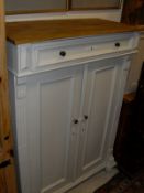 A continental pine and cream painted cupboard,
