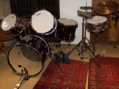 A five piece drum kit by Adder Pro and Canon with high hat, cymbals, bass, snare,