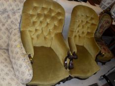 A pair of Victorian rosewood framed button back salon armchairs,